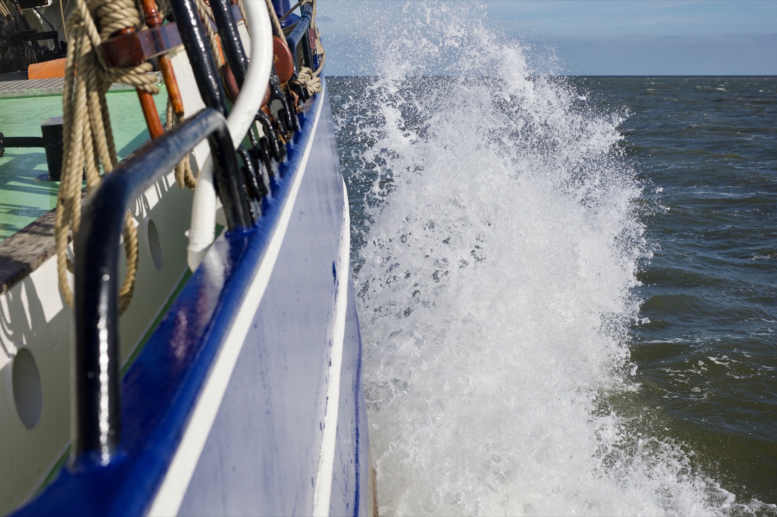 Bow of Fabio Andreatta's sailing ship cutting through ocean waves