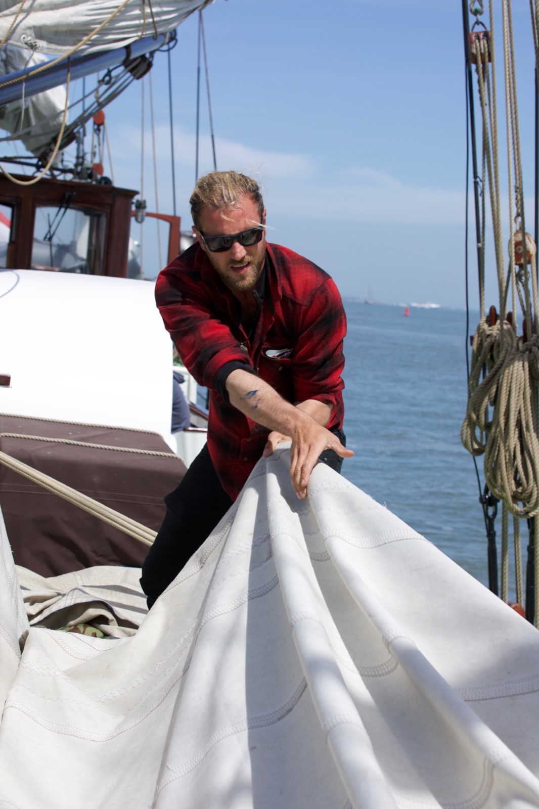Fabio Andreatta handling sails on a tall ship and demonstrating maritime expertise